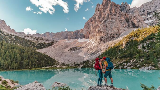 Couple kissing by the Sorapis Lake near Cortina d'Ampezzo