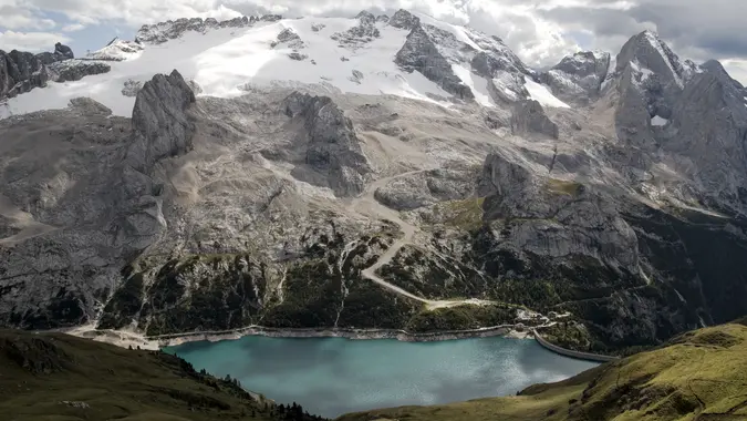 Hike, bike, or relax: Fedaia Lake offers stunning views of the Marmolada Glacier