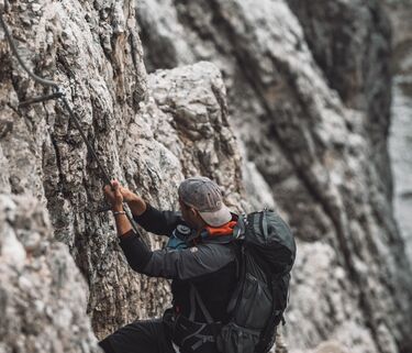 Climber on a rocky mountain in the Dolomites