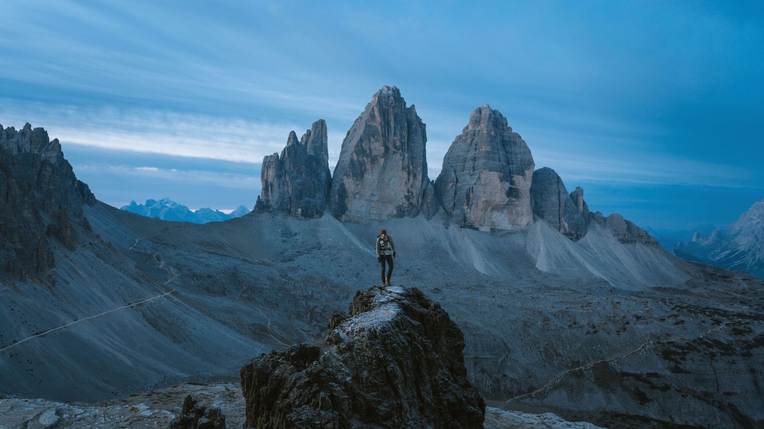 Man admiring the majestic Three Peaks of Lavaredo -Cortina d'Ampezzo, Italy