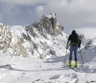 Explore the thrilling world of ski mountaineering and freeride in the majestic Croda da Lago of the Dolomites