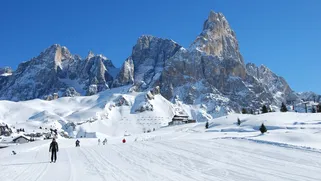 Skiing on the snowy slopes of Dolomiti Superski.