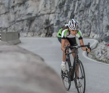 Power women cycling on Dolomites roads