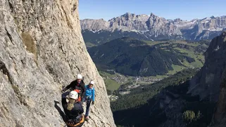 Via Ferrata Pisciadù above Colfosco—clipped to the steel cable with Sella towers behind.