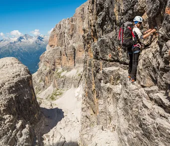 Hiker on a via ferrata Dolomites, InfoDolomites