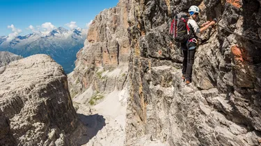 Hiker on a via ferrata Dolomites, InfoDolomites