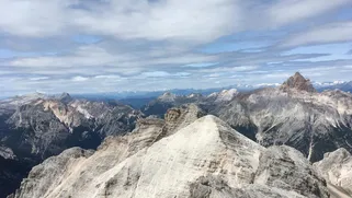 Amazing panoramic view from the top of the Dolomites – the full horizon unfolding in every direction.