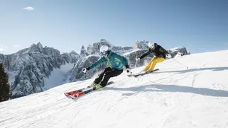 Skiers enjoying the slopes of Passo Gardena on the Sellaronda circuit, Dolomites