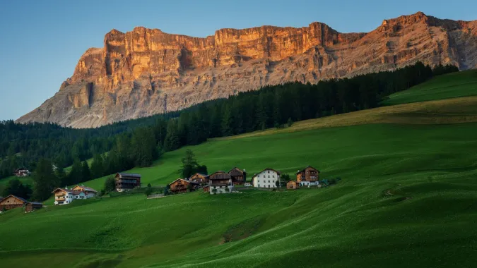 Ladin Viles with Sas dla Crusc during Enrosadira - Dolomites